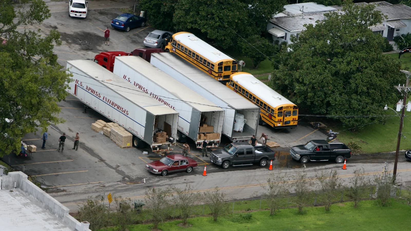 An aerial view of trucks and trailers backed into the loading docks of a distribution centre